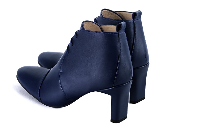 Navy blue women's ankle boots with laces at the front. Round toe. Medium comma heels. Rear view - Florence KOOIJMAN